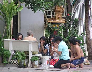 Family praying on the street